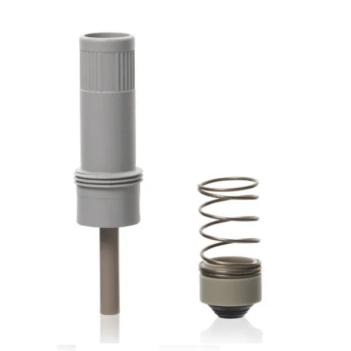 BT 705522 A gray plastic cylindrical piston with seal and a metal spring with round gray base, both upright on white, are parts from the Transferpette Electronic Piston + Seal with Spring, Single Channel, 10-200μL (BrandTech).