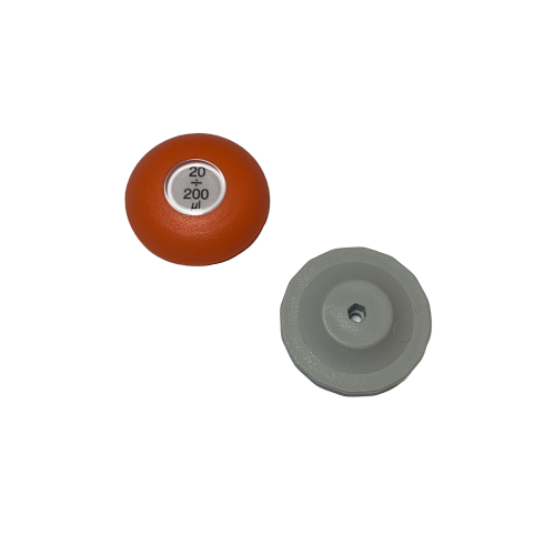 Two plastic caps on white: one orange cap reads "Lambda Plus Push Button, Single & Multichannel, Older Style, 200μL (Labnet/Corning)"; the other is plain gray. For use with Single & Multichannel pipettes.