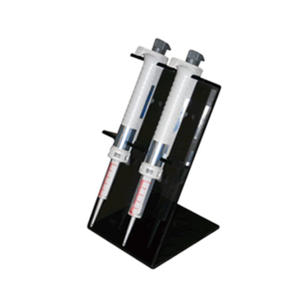 NI 00-NS-STD Two laboratory pipettes are upright in a Nichimate Stepper Pipette Stand (Nichiryo), with the Nichimate logo visible, set against a white background.