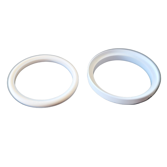 Two white plastic rings from the Nichipet EX Plus Teflon Seal / KPF Par-Fluo O-ring Set, 10mL (Nichiryo), one slightly larger and deeper than the other, are displayed side by side on a plain white background.
