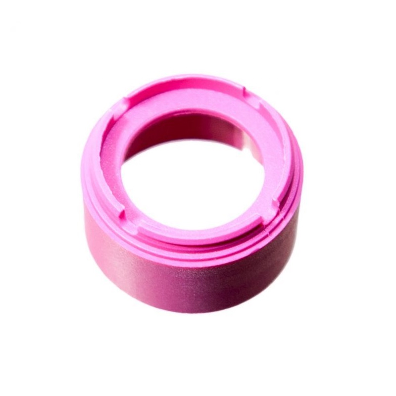 A pink Finnpipette Novus Tip Ejector Upper Part (Single Channel, 10μL Micro, Thermo Scientific) with a wide central hole and grooved inner surface is shown from above on a white background.