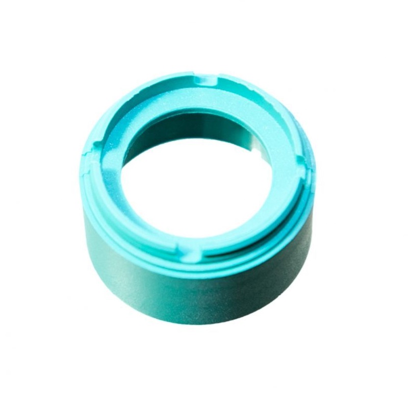 A turquoise Finnpipette Novus Tip Ejector Upper Part (50μL Micro, Thermo Scientific), made of plastic with a wide central opening, is shown against a white background.