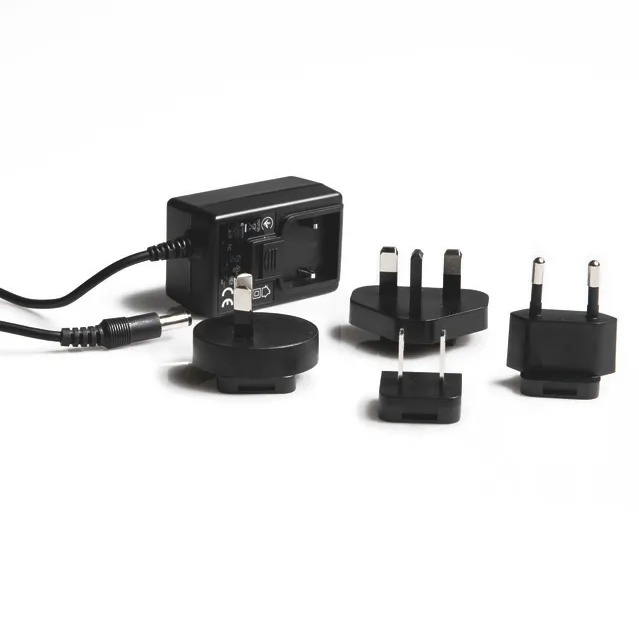The PLT Pipette Leak Test Unit AC Adapter / Universal Power Supply (BrandTech) features three interchangeable plugs for global use, perfect for powering your device. Shown on a white background.