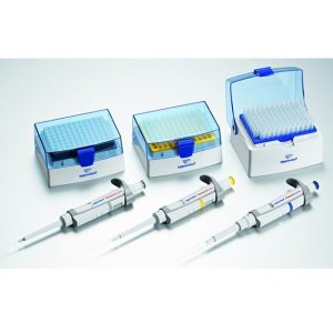 A pack of six Eppendorf Research Plus variable volume single channel pipettes (10μL–10mL) with a stand is arranged on a white surface beside boxes of blue and yellow pipette tips.