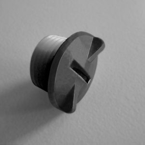 A close-up of the Titrette Air Vent Cap, All Volumes (BrandTech), showing its metallic slotted screw head and textured cylindrical shaft, set against a plain, light background.