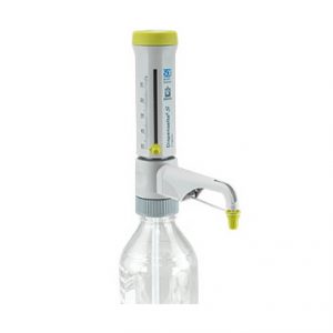 A Dispensette S Organic Bottletop Dispenser (Analog, Adjustable, 5–50mL) by BrandTech is attached to a clear bottle with volume markings and features an analog adjustable dispensing spout with a yellow tip.