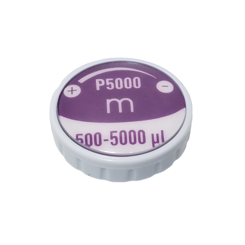 F807122 Purple and white plastic dial for Pipetman M Button Assembly, P5000M (Gilson), labeled "P5000M," "m," and "500-5000 µl" with plus/minus symbols, used to adjust the pipette’s button assembly.