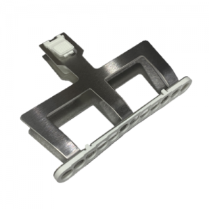 A metallic component with a rectangular base, two cut-outs, and a white plastic part with circular holes and a latch, designed for the Pipetman M Tip Ejector Assembly, Multichannel, 12 Channel, 1200μL (P12x1200M), by Gilson.