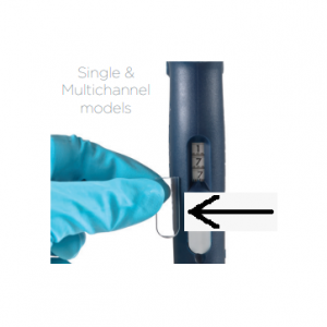 A gloved hand holds a plastic clip near a Gilson Pipetman L Window, Single & Multichannel, All Volumes, 5 Pack lab pipette with visible volume display. An arrow points to the clip. Text reads: Single & Multichannel models.