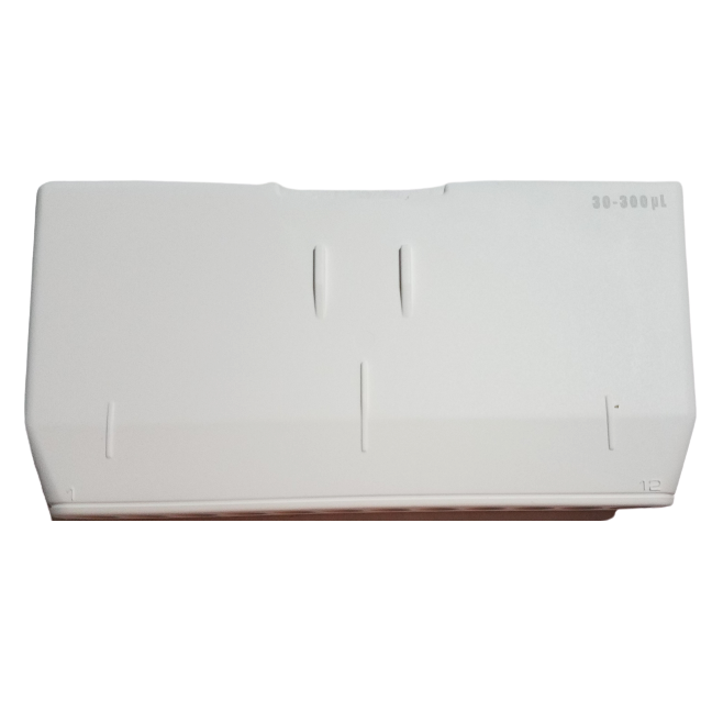 The Pipetman G Housing Kit (Gilson) is a white plastic lid for a 12-channel, 30–300 μl multichannel pipette, featuring three indented grooves and a faint "12" on the lower right edge.