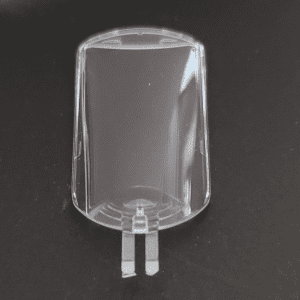 A clear plastic HandyStep S, Housing Clip, Backside (BrandTech) with two bottom prongs is shown on a black surface.