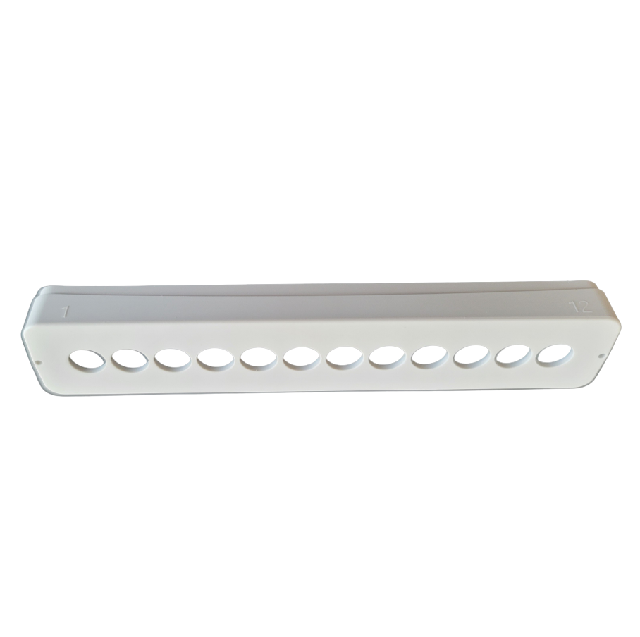 The Research Plus, Xplorer/Xplorer Plus Ejector Multichannel 12-Channel 1200μL (Eppendorf) features a white plastic strip with twelve evenly spaced circular holes, marked with numbers 1 and 12 at opposite ends for multichannel pipette use.