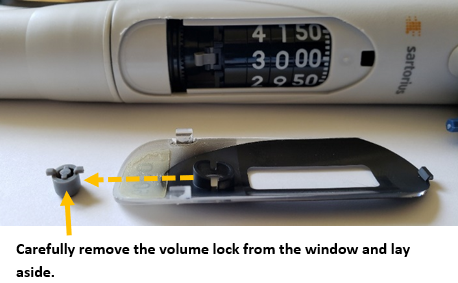 Grey volume lock. Carefully remove the volume lock from the window and lay aside.