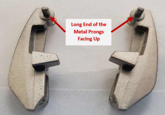 volume catch long end metal prongs facing up