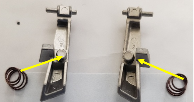 spring placement on volume catch