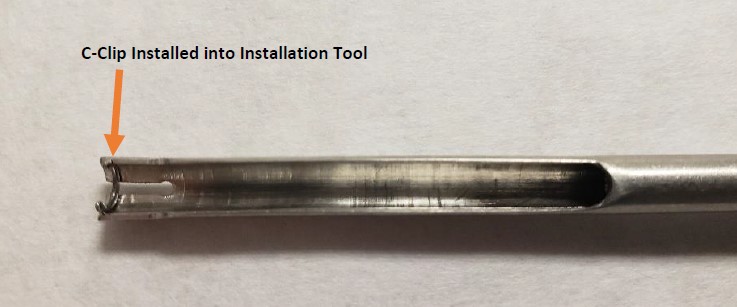 c-clip installed into installation tool