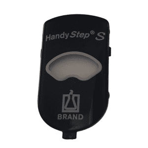The HandyStep S, Housing Clip, Front by BrandTech is a black plastic accessory with a window and a flask icon above "Brand" on the front, designed for durability and secure attachment.