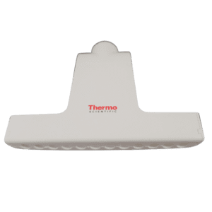 A white Thermo Scientific Finnpipette F1 Upgrade 12-channel tip ejector (50μL, 100μL, 300μL) with a flat, wide shape and rounded top, viewed from above against a plain background.
