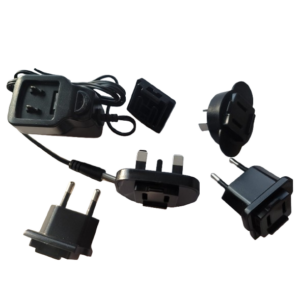 The Corning Stripettor Pro & Ultra Pipet Controllers Universal Power Supply, 9V with Adapters (Labnet), is shown on a white background with interchangeable international plug attachments for different socket types.