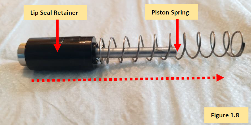 Remove piston spring from piston spine