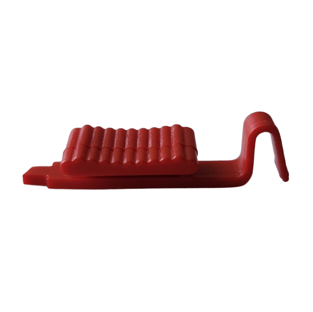 The Portable Pipet-Aid XP Nose Piece Release, Red (Drummond), features a ridged rectangular design with a hooked end, displayed against a plain white background.