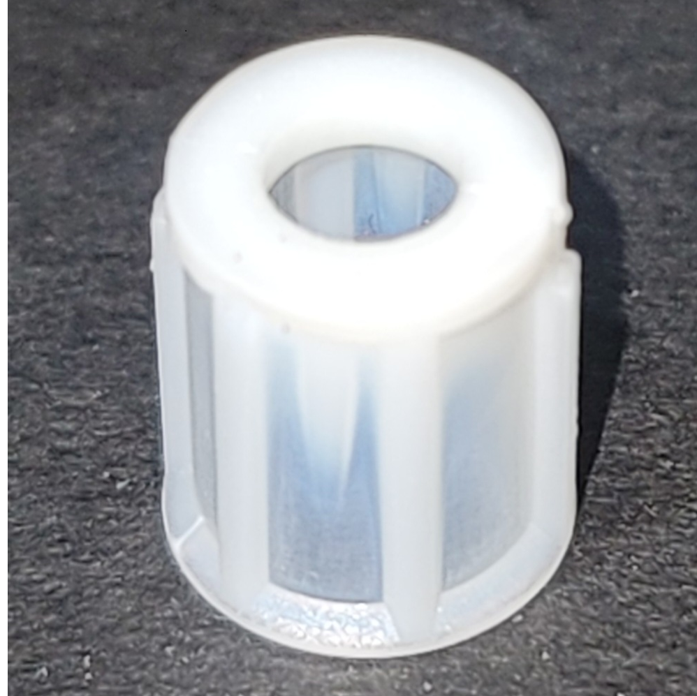 A close-up of a white, ridged Rainin Classic Small Spring Positioner (2µL–200µL) is shown on a dark surface.