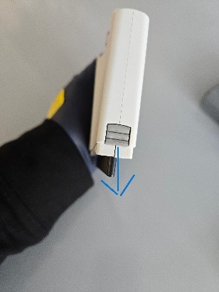 Gloved hand holding a white Eppendorf Research Plus with a grey button, featuring a blue arrow pointing downward, illustrating the Nose Cone Replacement process.